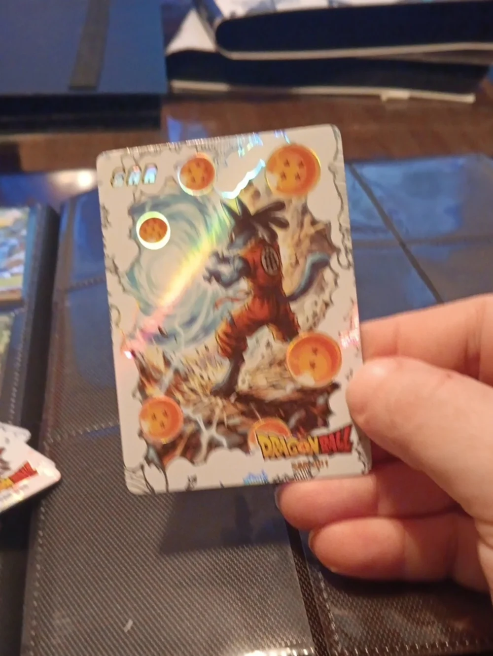 Pokemon trading card with orange and blue holographic art